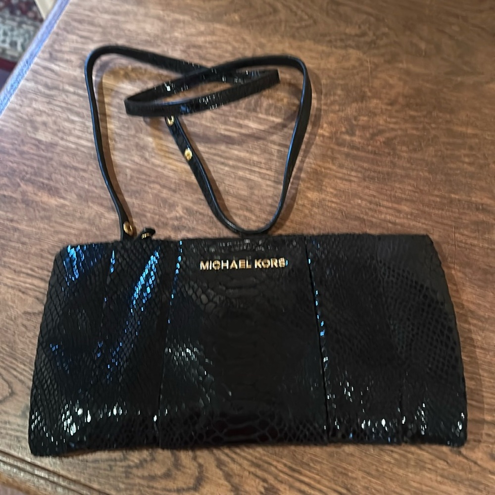 Black and beautiful large Michael Kors clutch in crocodile patent pattern!